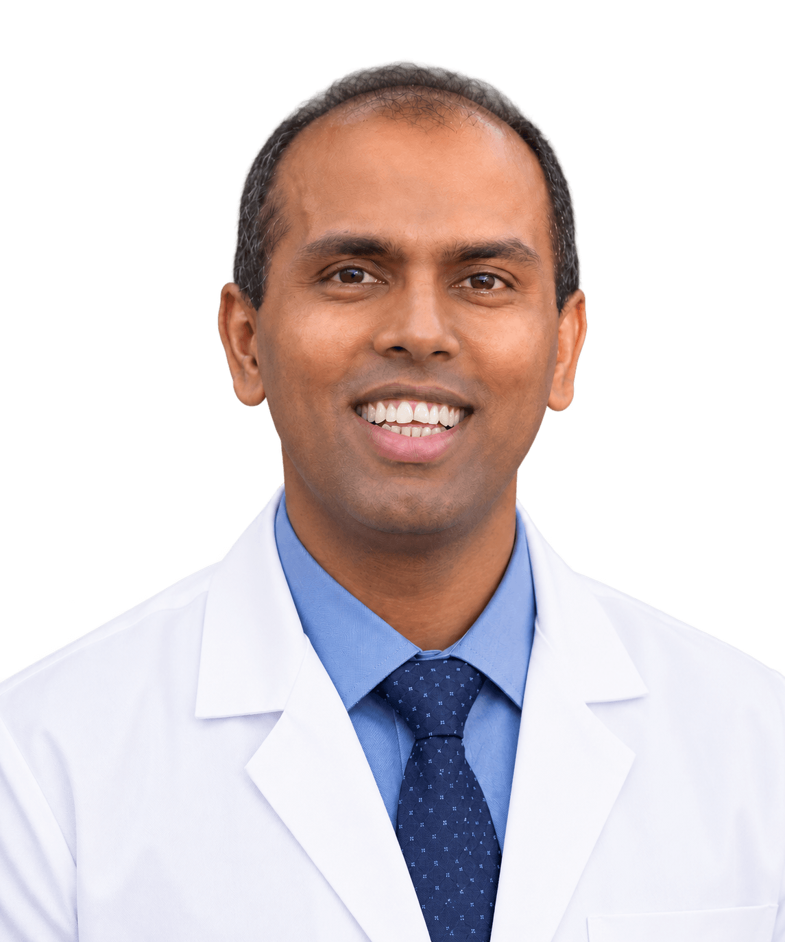 Dr. Vinay Kumar wearing a white coat
